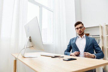 Fototapeta premium a man in a suit at the desk in the office an official executive