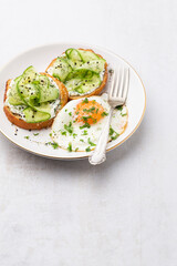 Keto Toasts with ricotta, egg, cucumber and black sesame.