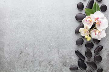 Spa stone, orchid theme objects on grey background.