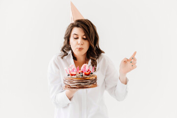 a lilt woman with a birthday cake with candles.