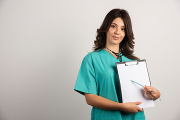 Smiling doctor with stethoscope showing good news