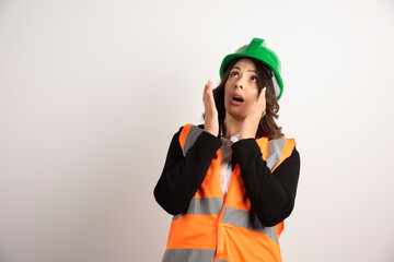Worried woman worker looking upside