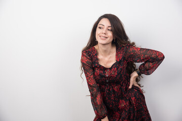 Fototapeta premium Portrait of long haired woman bending over with happy expression