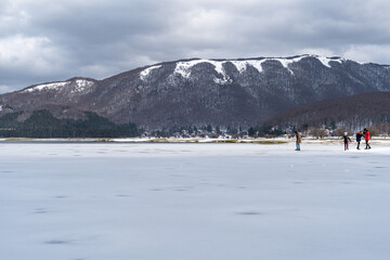 Fototapeta na wymiar Frozen surface of Laceno Lake during winter, Campania, Italy