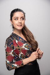 Woman with ponytail hair looking at somewhere