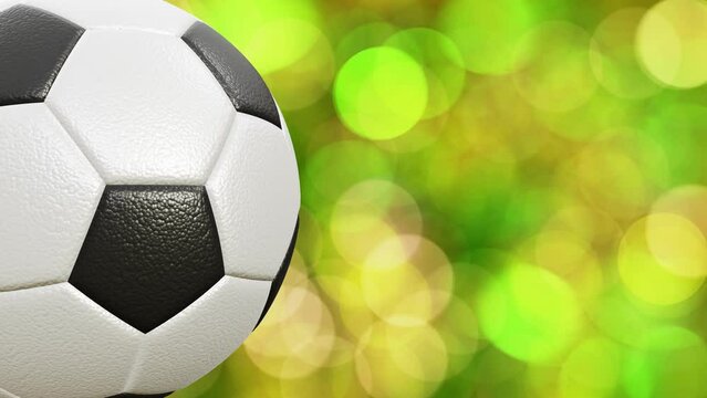 Side camera realistic looping 3D animation of the classic soccer or football ball against beautiful sunny green bokeh light particles rendered in UHD
