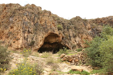 Entrance of rocky natural cave in the nature in Almeria Andalusia Spain