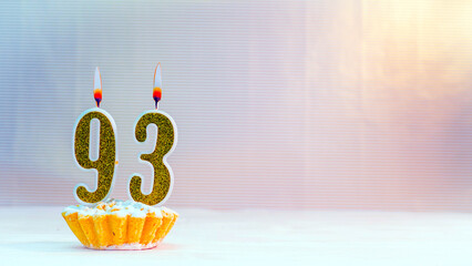 Happy birthday card from candles with the number  93, golden numbers from candles for congratulations on any holiday.
