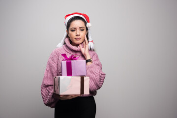 Charming lady in stylish holiday dress looking at away with happiness and calmness