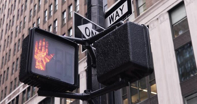 Pedestrian Traffic light in NYC switching from walk to don't walk with countdown. Pedestrian safety in Manhattan, new York City - Powered by Adobe