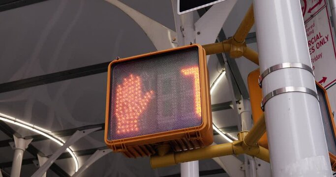 Walk to don't walk in NYC. Traffic light countdown. red numbers. Safely crossing road in Manhattan.