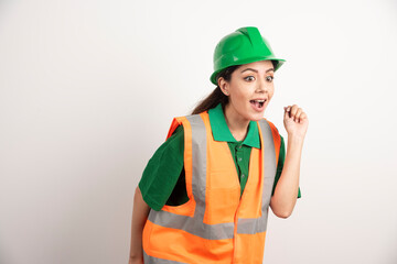 Female construction site engineer with helmet