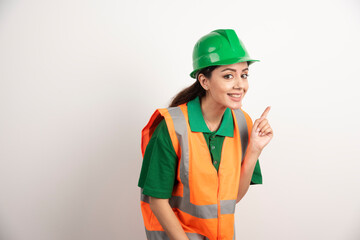 Successful woman in hardhat wearing uniform