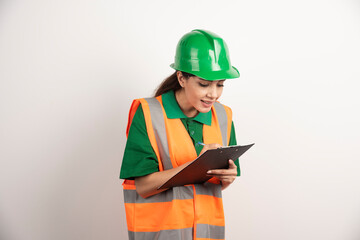 Industrial worker woman with pencil and clipboard