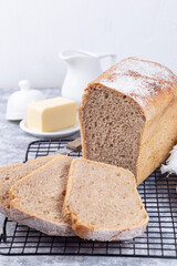 Slices of homemade no knead sandwich bread on cooling rack, vertical