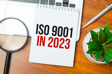 Word writing text ISO 9001 in 2023 . Business concept on the table chart
