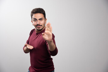 Fototapeta premium A young brunette man standing and posing