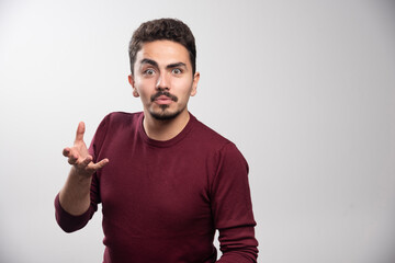 Fototapeta premium A serious brunette man standing and posing