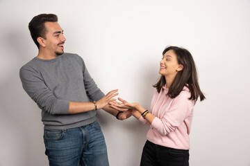 Young couple sharing their stories on white background