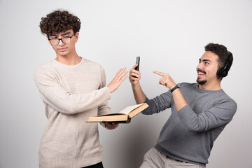 One man trying to take picture another man