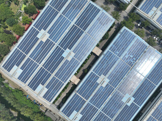 Obraz premium solar panels on factory rooftop