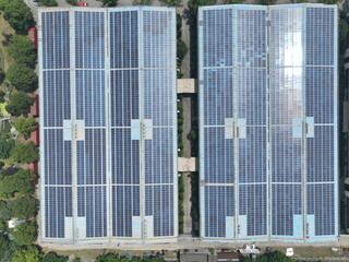 Obraz premium solar panels on factory rooftop