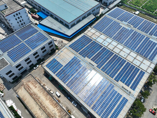 Obraz premium solar panels on factory rooftop