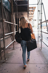 Fototapeta na wymiar woman walking down the street downtown miami shopping 