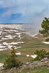 the beginning of summer, morning on a mountain plateau, a panorama of the mountainous terrain, awakening in nature and the birth of a new life.*