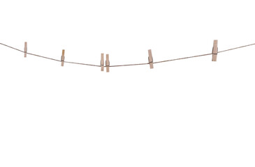 Six wood clothes pegs patterns hanging on brown string isolated on white background , clipping path