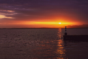 Fototapeta premium Sunset at the lake pier.