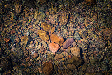 Rocks at the bottom of the lake as a background