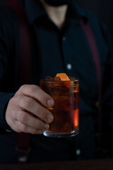 person holding glass of rum