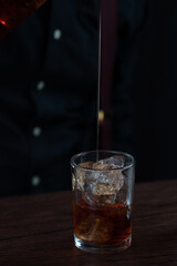 a glass of whiskey and ice