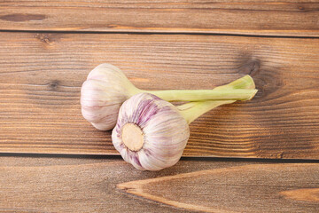 Two Young garlic over background
