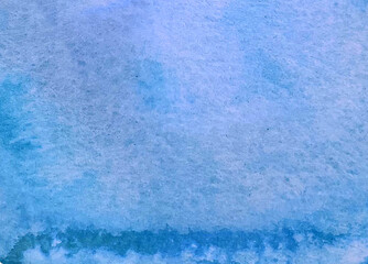 Watery blue watercolor full background paper and paint texture wallpaper