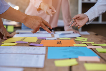 Close up of hands working and brainstorming on paperworks about business financial and marketing.