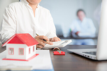 Small house model on wooden table