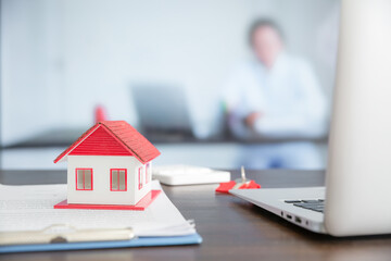 House model on wooden table in office