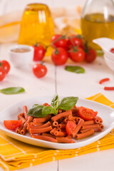 Lentil pasta with cherry tomatoes and basil.