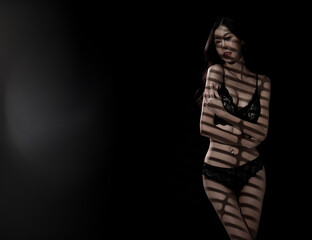 Fototapeta na wymiar Half body Asian beautiful woman wear black lingeries with sexy shape and long hair