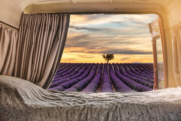 View from the inside of a campervan adapted the lavender fields in provence, France at at sunset -...