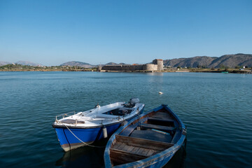 Ksamil, Albania, A view over Lake Butrint and the Venetian Triangle Castle.