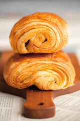 Croissant macro. French croissant with waves. Air baking. Croissant for puff pastry advertising. Croissant for a magazine.French breakfast with pastries. From puff pastry. Bun from France. Roll macro