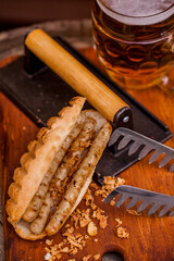 American hot dog with three sausage and a glass of beer