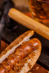 American hot dog with sausage and a glass of beer