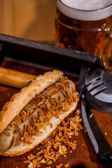 American hot dog with sausage and a glass of beer