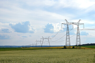 Fototapeta na wymiar power lines running through an agricultural field