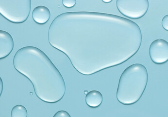 Liquid gel cosmetic drops texture on blue background. Skincare hygiene product closeup. - obrazy, fototapety, plakaty
