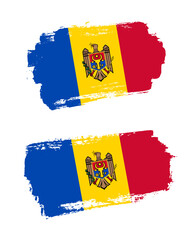 Set of two creative brush painted flags of Moldova country with solid background